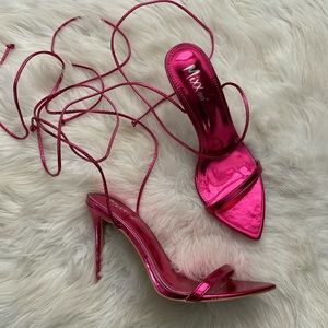 Hot pink metallic lace up heels.